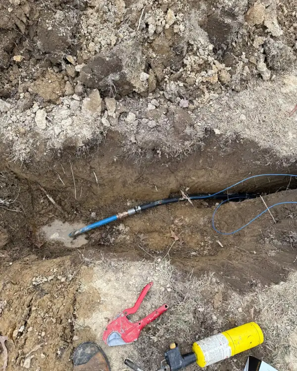 New water service line laid in the trench.
